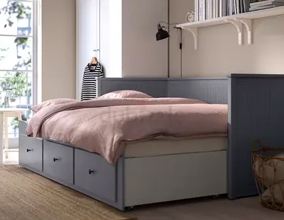 Grey daybed with storage drawers — solid wood frame, good condition