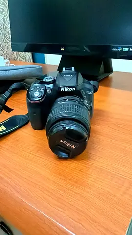 Used Nikon DSLR with 18-55mm Kit Lens and Strap - Good Condition