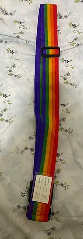 Travel bag holding buckle belt rainbow