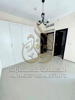 For annual rent in Al Majaz 2, Sharjah, a distinctive apartment featuring two master bedrooms and a