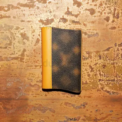 Brown textured leather bi-fold wallet with mustard trim Louis Vuitton Virgil a log wallet