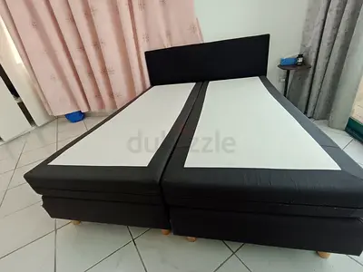 Pair of black single divan beds with headboard (can be used as double)