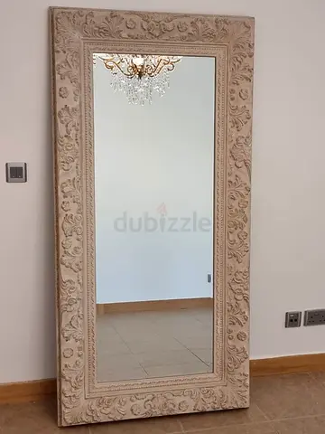 Large wall mirror with ornate frame