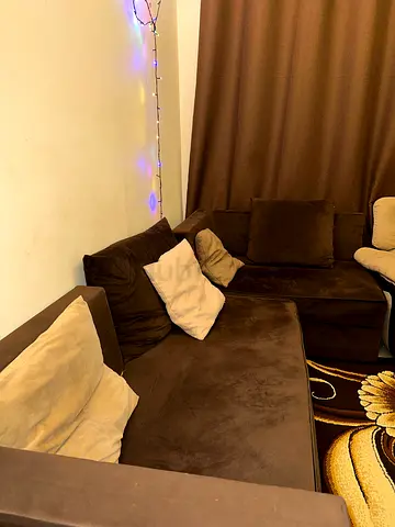 Brown L-shaped sectional sofa in good condition - Urgent Sale