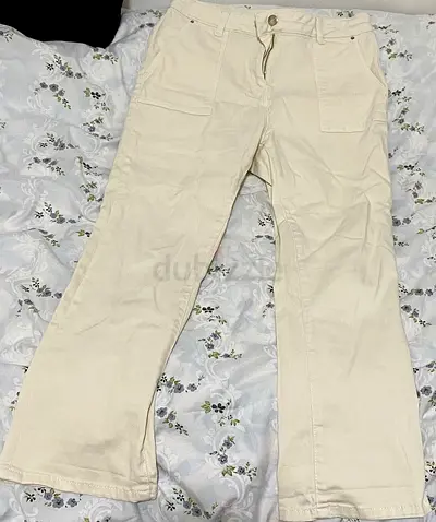 Cream colored denim jeans pants flared a bit at the bottom size 12 women