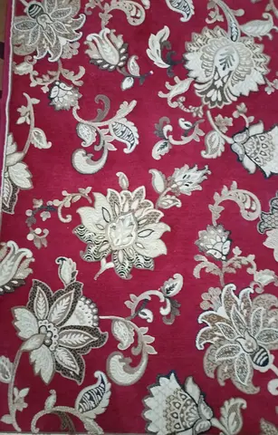 Red floral patterned area rug - good condition