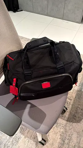 Tumi Mason Black travel duffel bag with shoulder strap — good condition