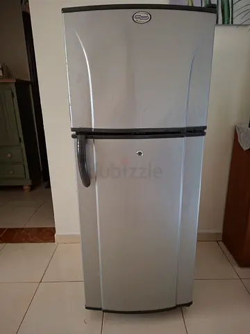 Silver double-door refrigerator in good working condition