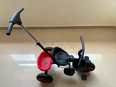 Used toddler tricycle with parent push handle — good condition