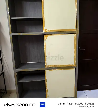 Tall wooden storage cabinet with sliding doors - good condition
