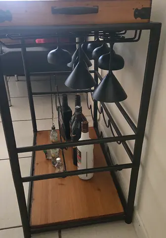 Compact metal and wood bar trolley with wood holders