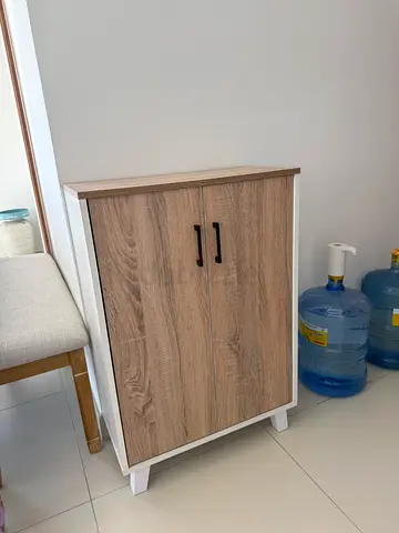 Small two-door storage cabinet - oak finish with white frame