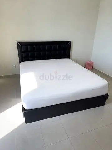 King bed with padded headboard
