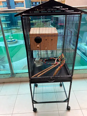 Large metal bird cage with wooden nesting box and stand (on wheels)