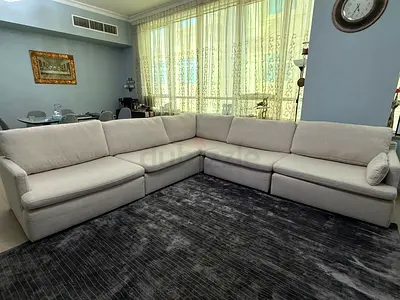 Beige L-shaped sectional sofa — good condition, spacious seating.