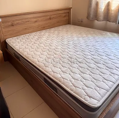 King size wooden bed with mattress