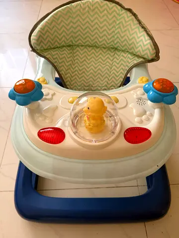 Baby activity walker with music and canopy - good condition