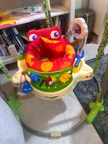 Baby jumper / Bouncer with toys - great condition - 4 months old only