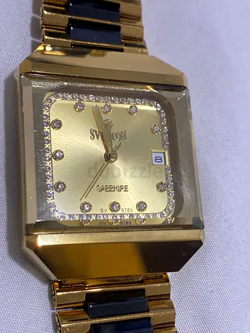 Gold-tone womens Swarovski-style square watch with crystal markers
