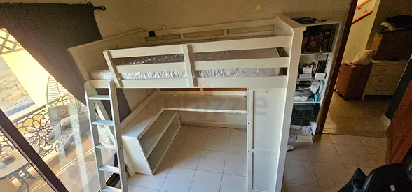 White wooden loft bed with built-in desk and shelving - good condition used for 1 year only