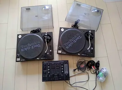 Set of Technics Quartz Direct Drive Turntable System SL-1200MK5.
Pioneer DJ mixer DJM-300