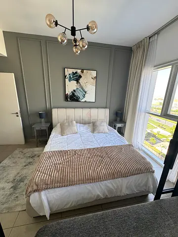 King bed frame with mattress and bedside tables and lamps - good condition
