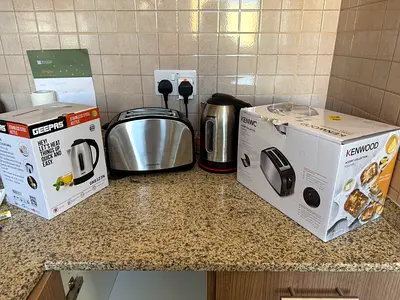 Stainless steel toaster and electric kettle set (used) - includes boxes