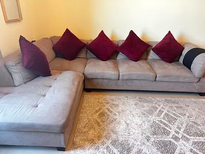 Light grey L-shaped corner sofa with chaise, good condition
