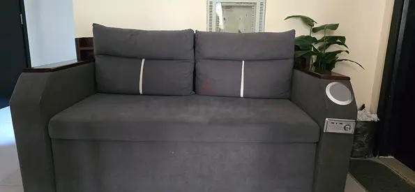 Sofa cum bed with bluetooth speaker and storage space