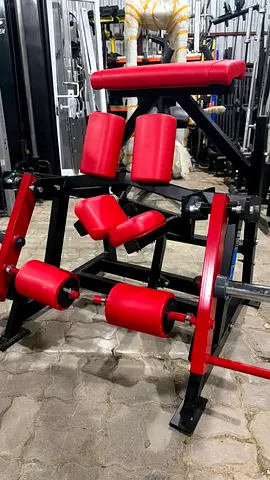 Leg Extension and Curl Machine — Red/Black Gym Equipment (Used)