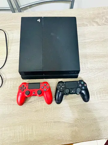 Sony PlayStation 4Console with Two DualShock Controllers