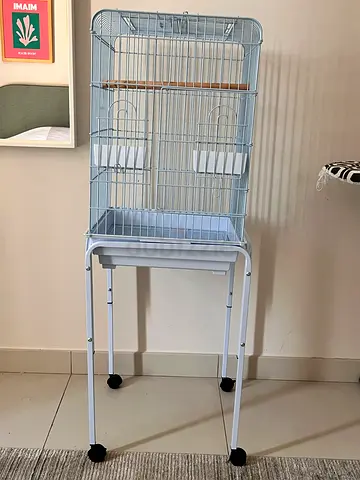 White metal bird cage with stand and wheels — good condition