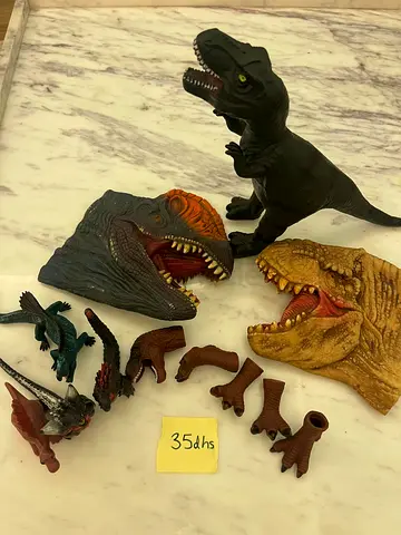 Used dinosaur heads and T-rex toy collection - set of figures and parts