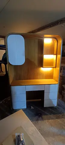Wooden bedroom dresser with built-in shelving and lights