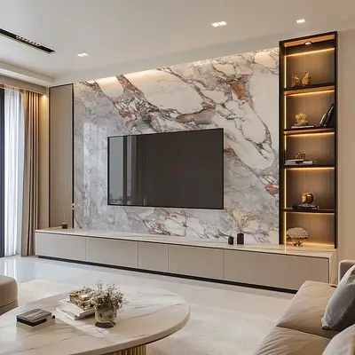 Modern built-in entertainment unit with marble feature wall and LED shelves
