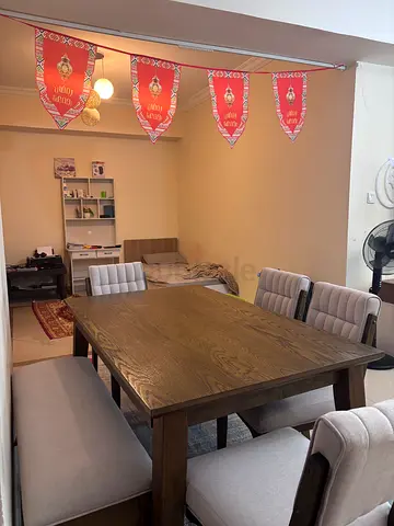 Solid wood dining table with 6 upholstered chairs - good condition