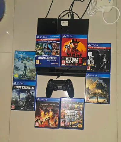 PlayStation 4 console with DualShock controller and 8 PS4 games bundle