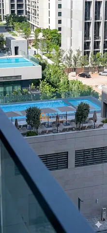 One-bedroom apartment for annual rent in Al Jadeh, with a pool view.
