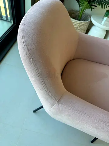Light pink upholstered accent chair with metal legs - good condition