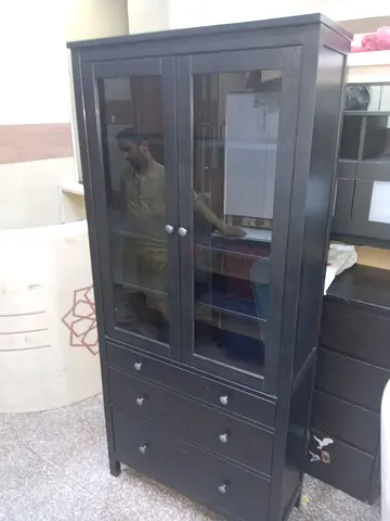 IKEA black glass-door cabinet with drawers - good condition