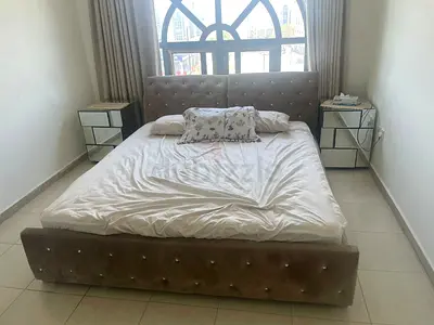 Queen upholstered bed with mirrored bedside tables - good condition