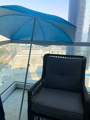 Blue outdoor beach umbrella with stand — excellent condition