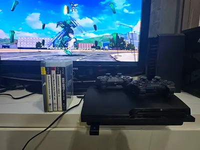 Sony PlayStation 3 Slim with 2 Controllers and Games