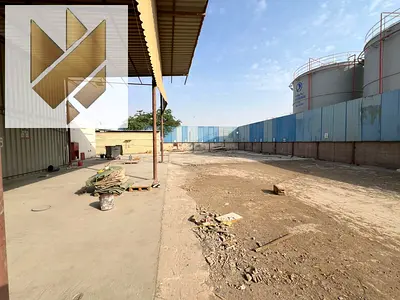 Industrial Yard for Rent in Al Sajaa | 20,000 Sq. Ft. | 6 Labor Rooms | 70 KW Power | AED 350,000 Negotiable
