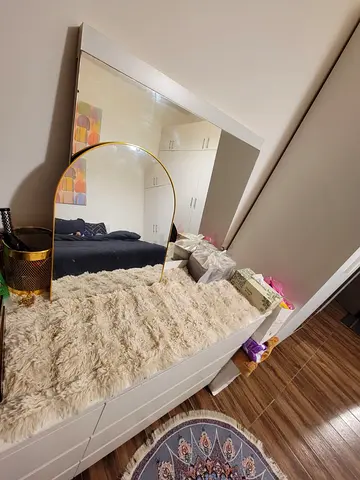 White Dresser with Large Mirror and Faux Fur Runner