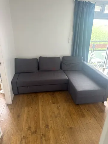 Grey L-shaped Sofa Bed with Storage - Good Condition