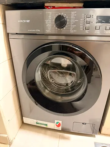 Front-load washing machine in good working condition.. less than 1 year old