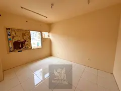 A room and a living room for singles in Al Bu Tinah, in a vital location close to all services and t