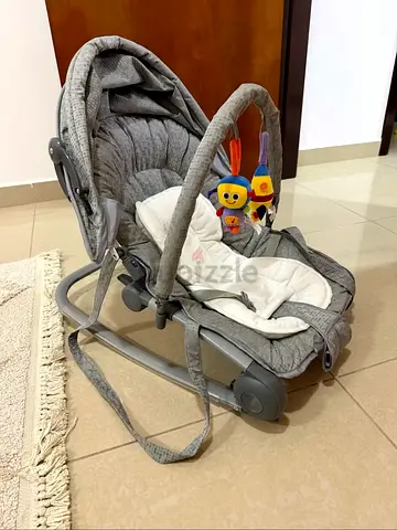 Lightly used grey baby rocker/soothing bouncer with toy bar