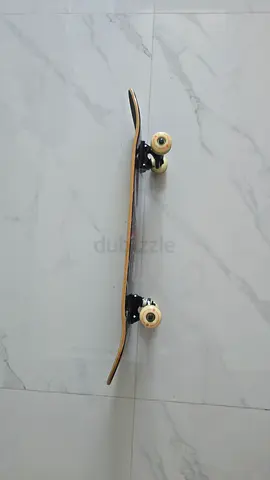 Used standard double-kick skateboard - good condition